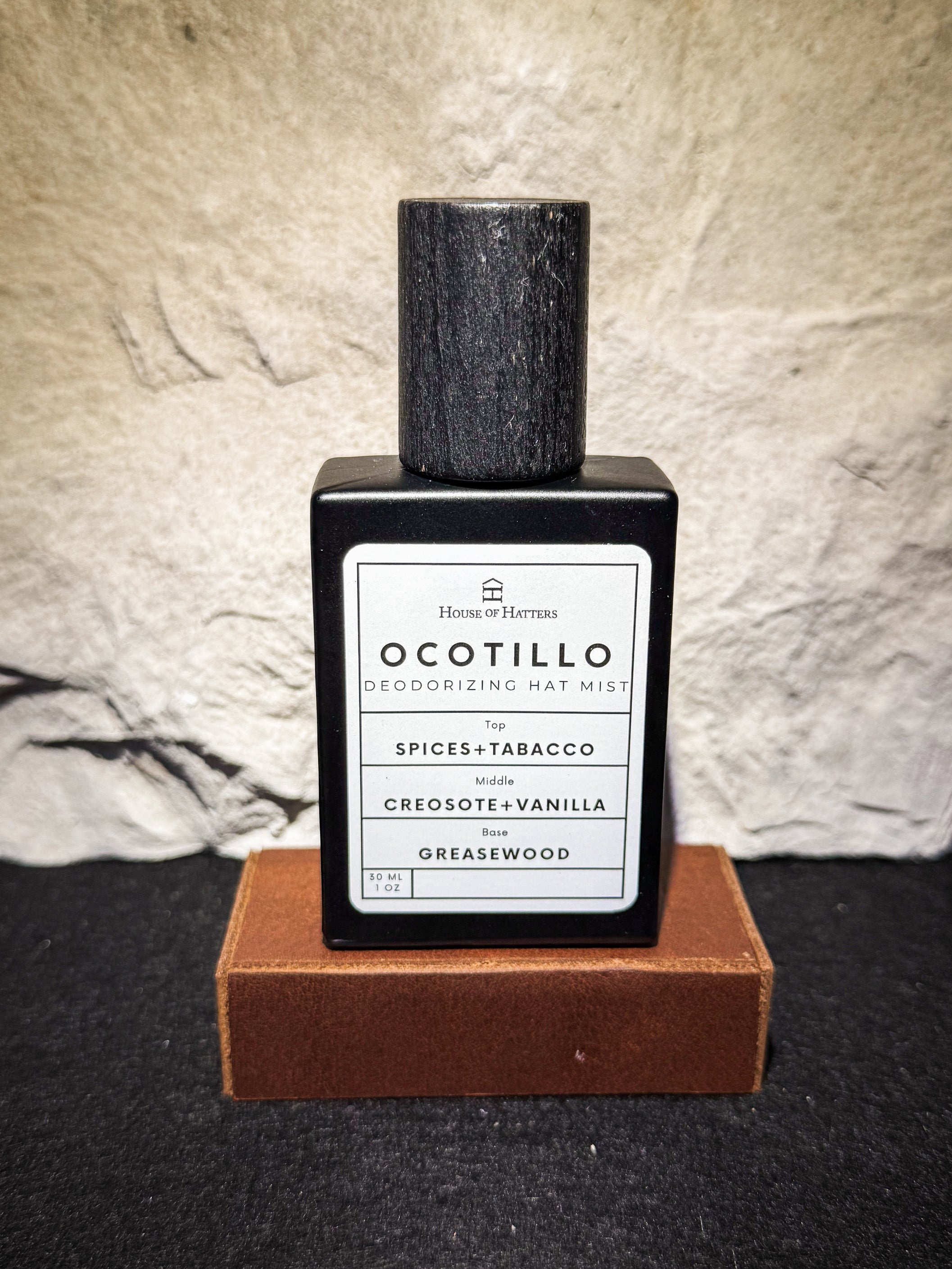 Ocotillo deodorizing mist bottle with label on a textured surface