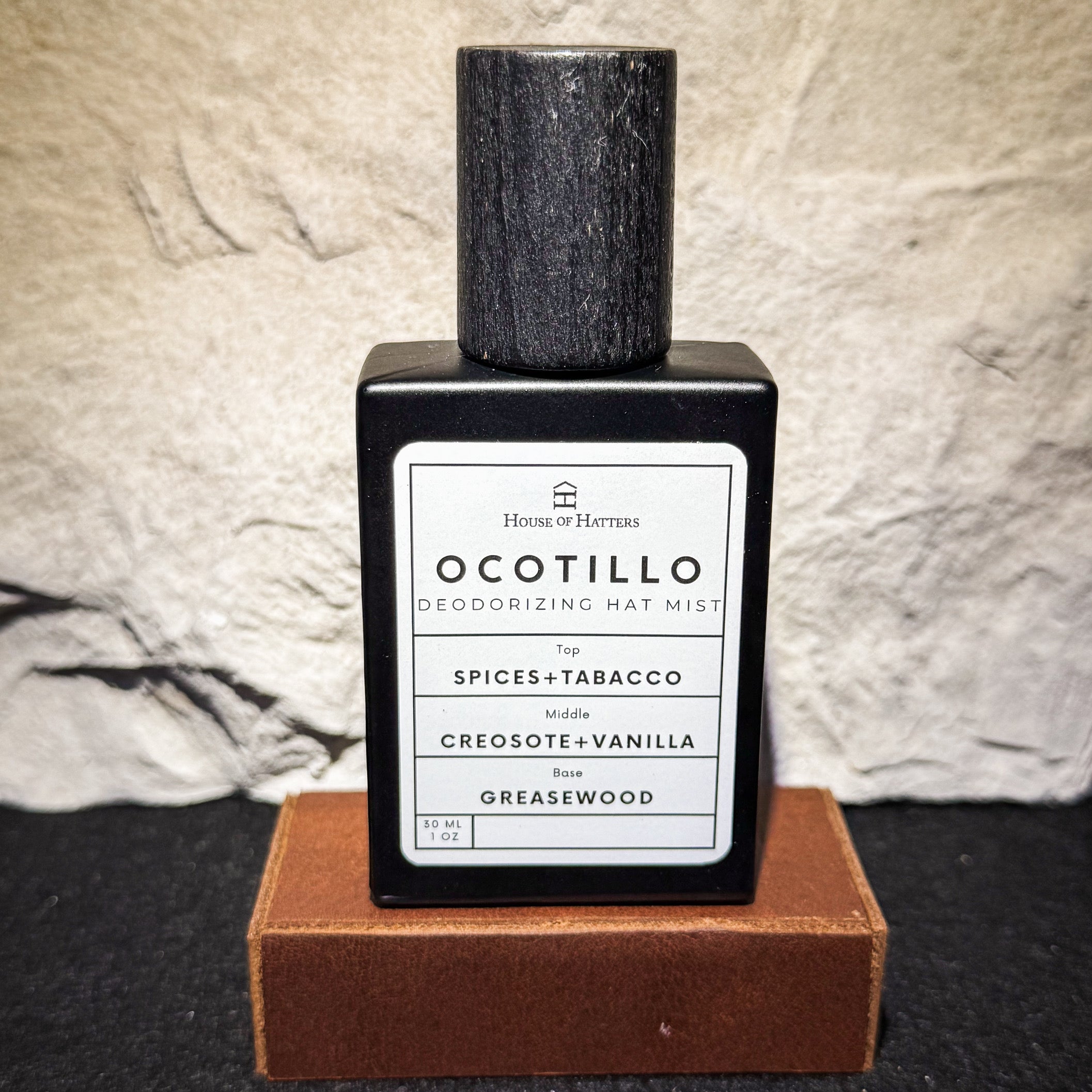 Ocotillo deodorizing mist bottle with label on a textured surface