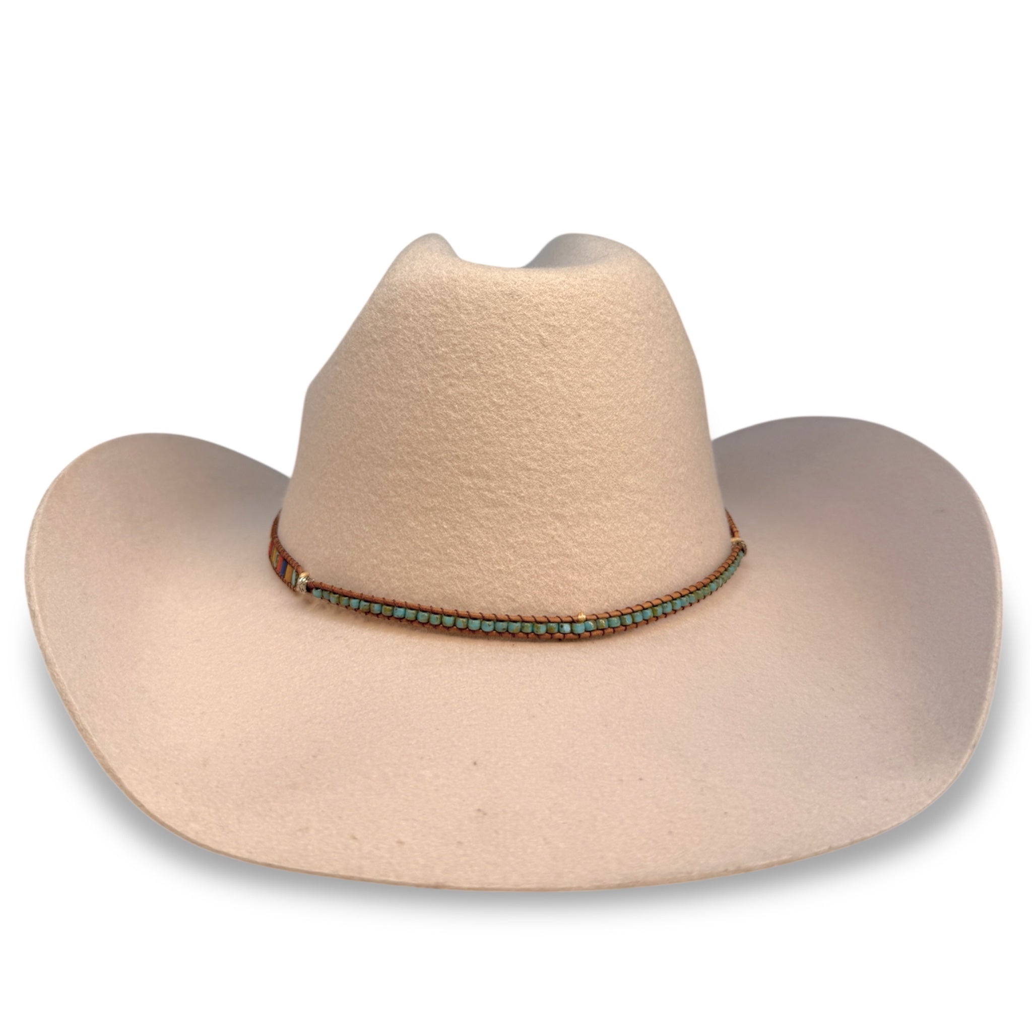 Front view of beige cattleman crown cowboy hat with a beaded hat band.