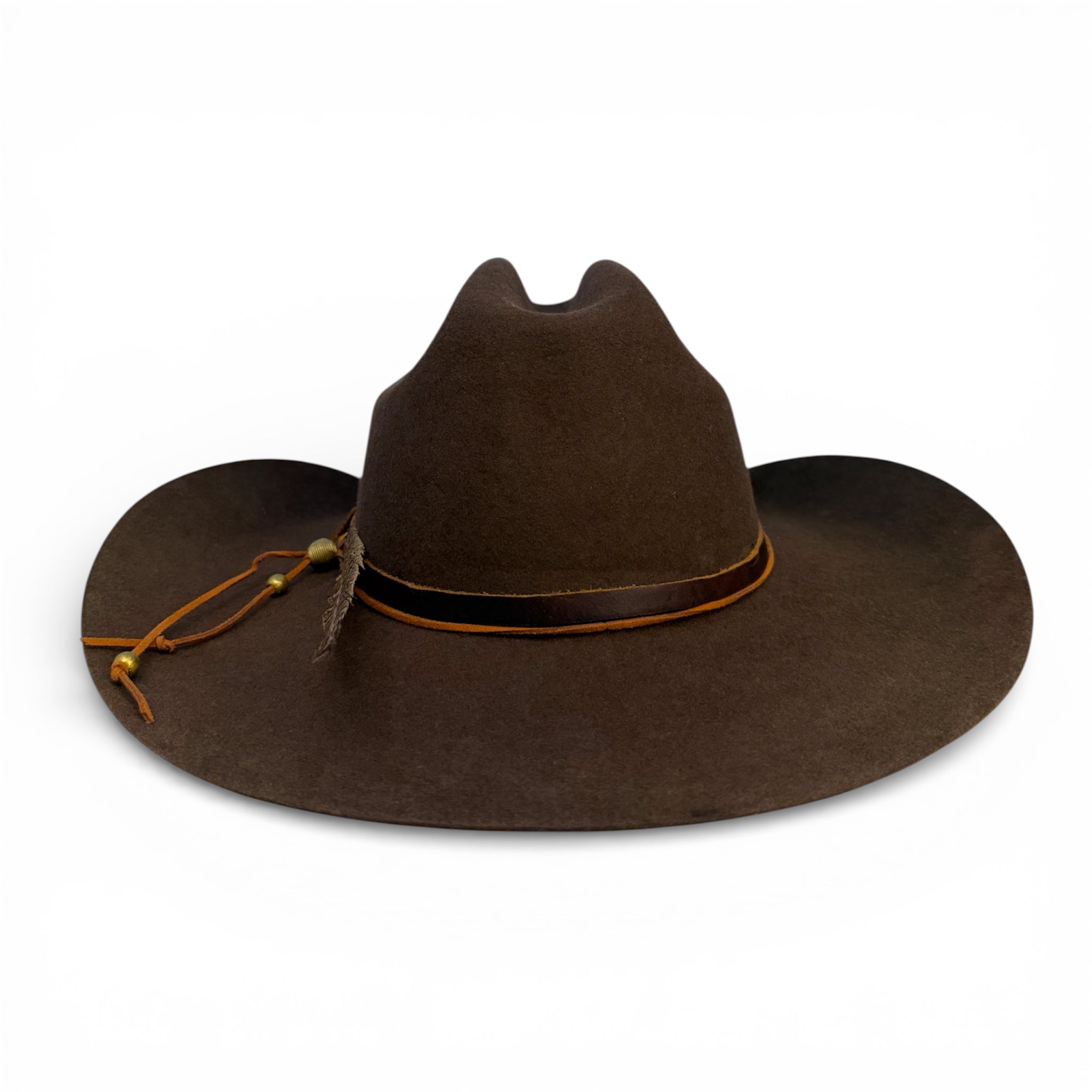 Back view of brown felt cowboy hat showing more of the leather hat tie with brass beads.