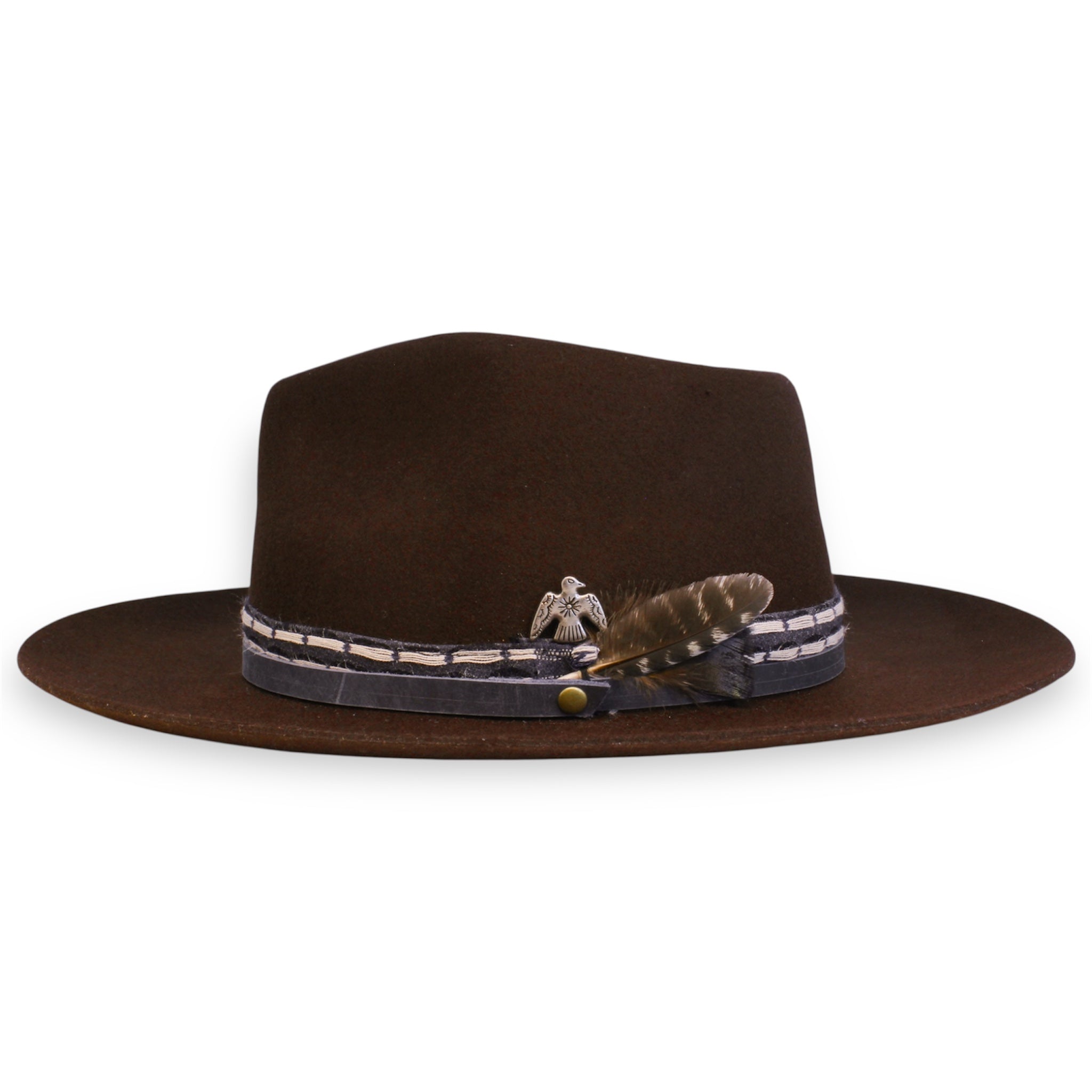 A brown short brim hat viewed from the feather side. There is a small feather and silver thunderbird concho.