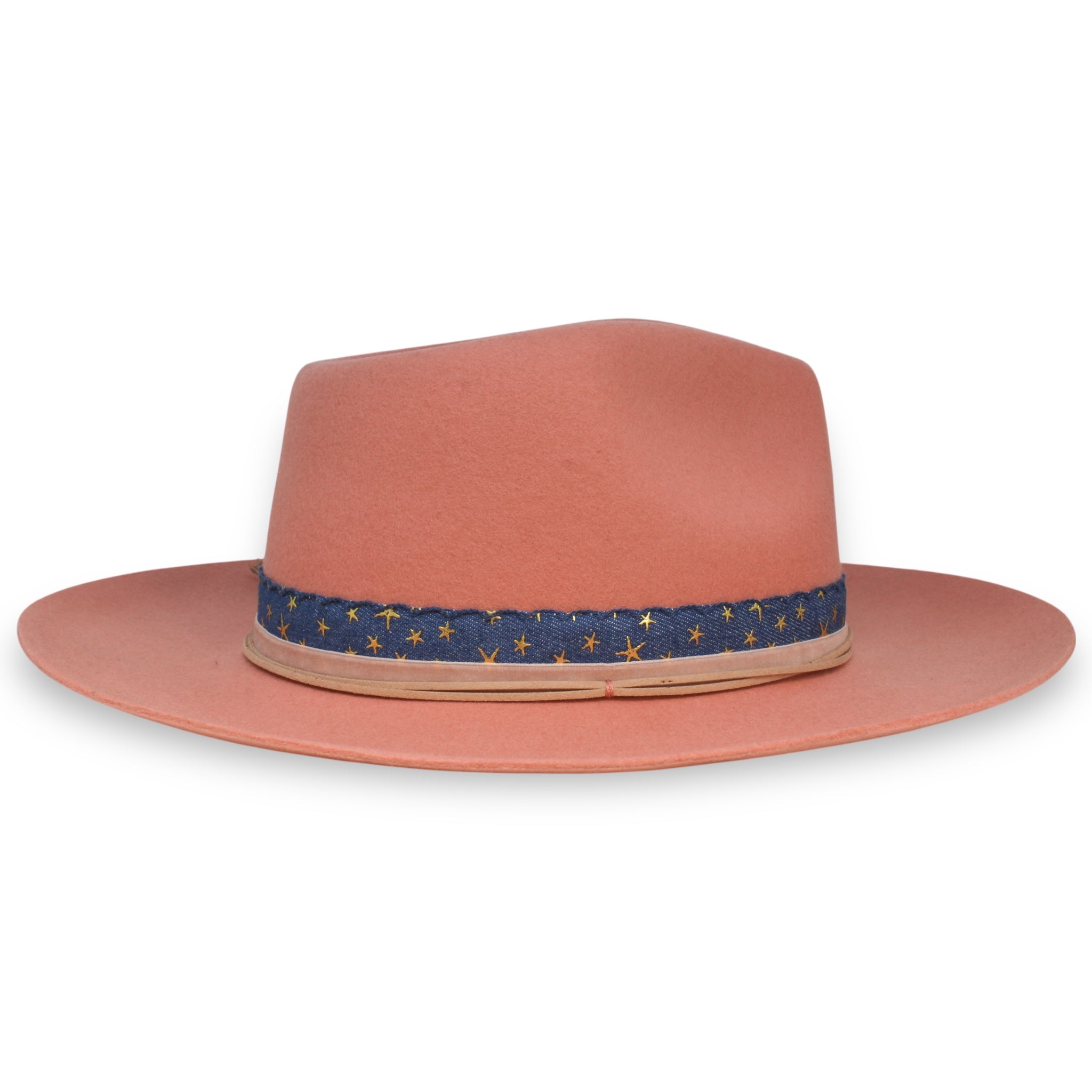 The opposing side profile of a saturated pink hat with three types of decorative ribbon.