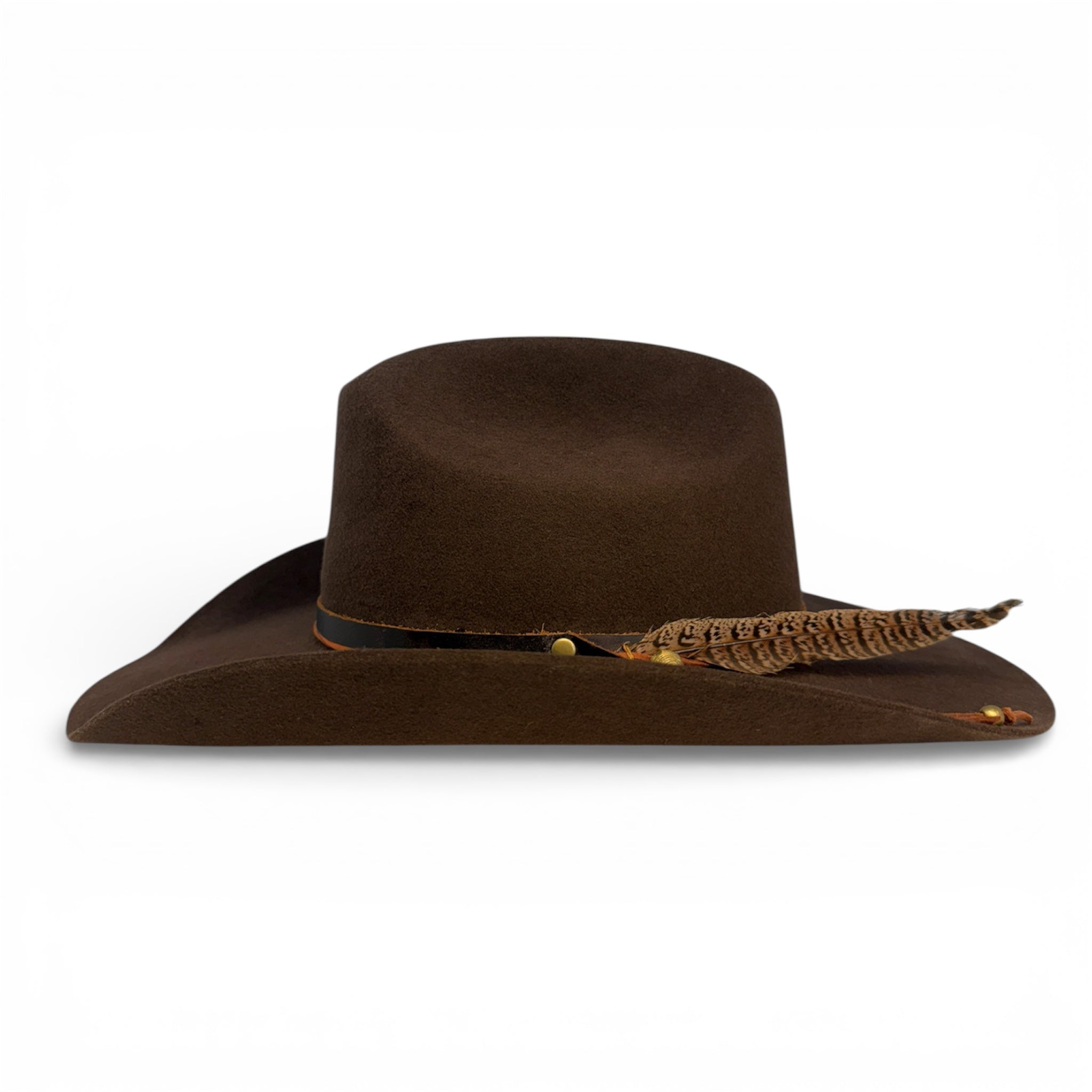 Side view of custom brown felt cowboy hat showing the wings of the hat, the hat band, and ringneck pheasant feather.