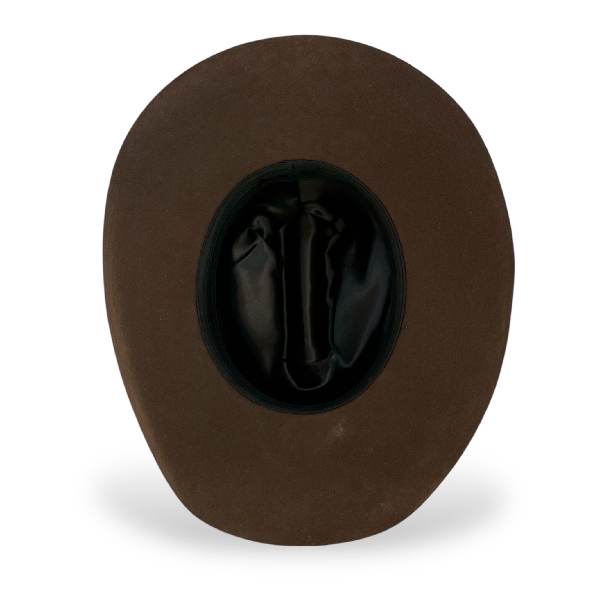 The underside view of a western felt hat including a black cloth sweatband and black lining.