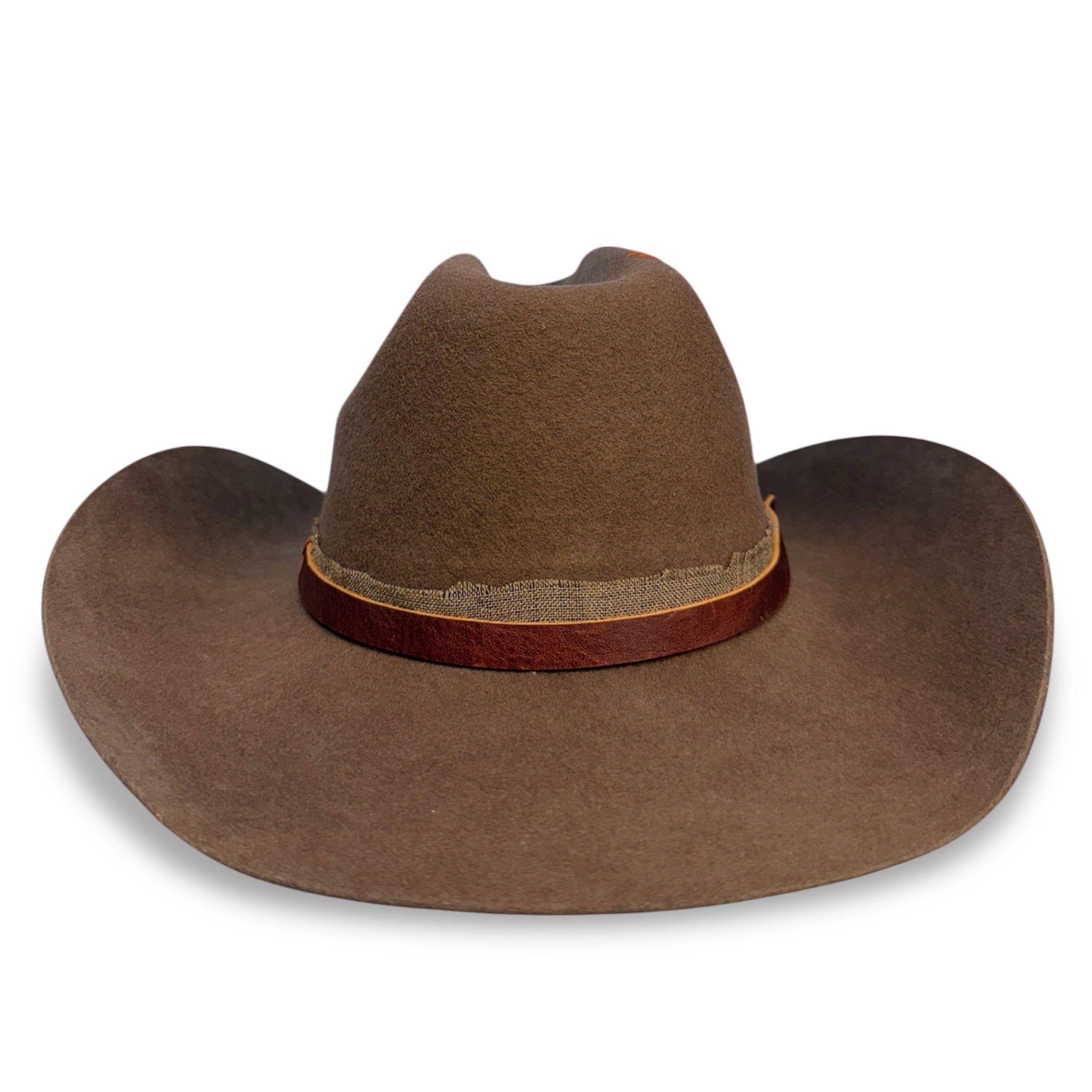 Front view of brown cattleman crown cowboy hat with leather hat band and burlap fabric ribbon.