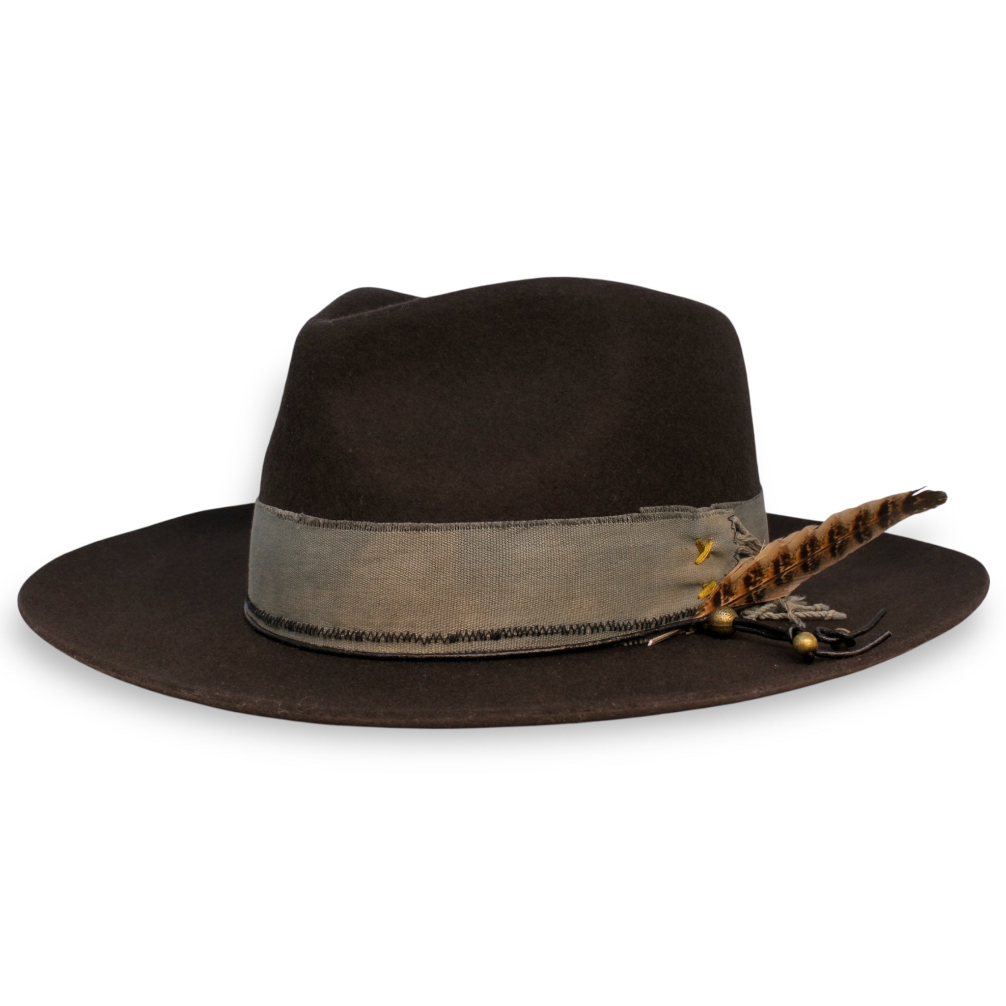 A crafted charcoal fedora with a short lifted brim. On the hat are an off-gray textile band, a black hat tie with brass beads, and a large feather by House of Hatters.