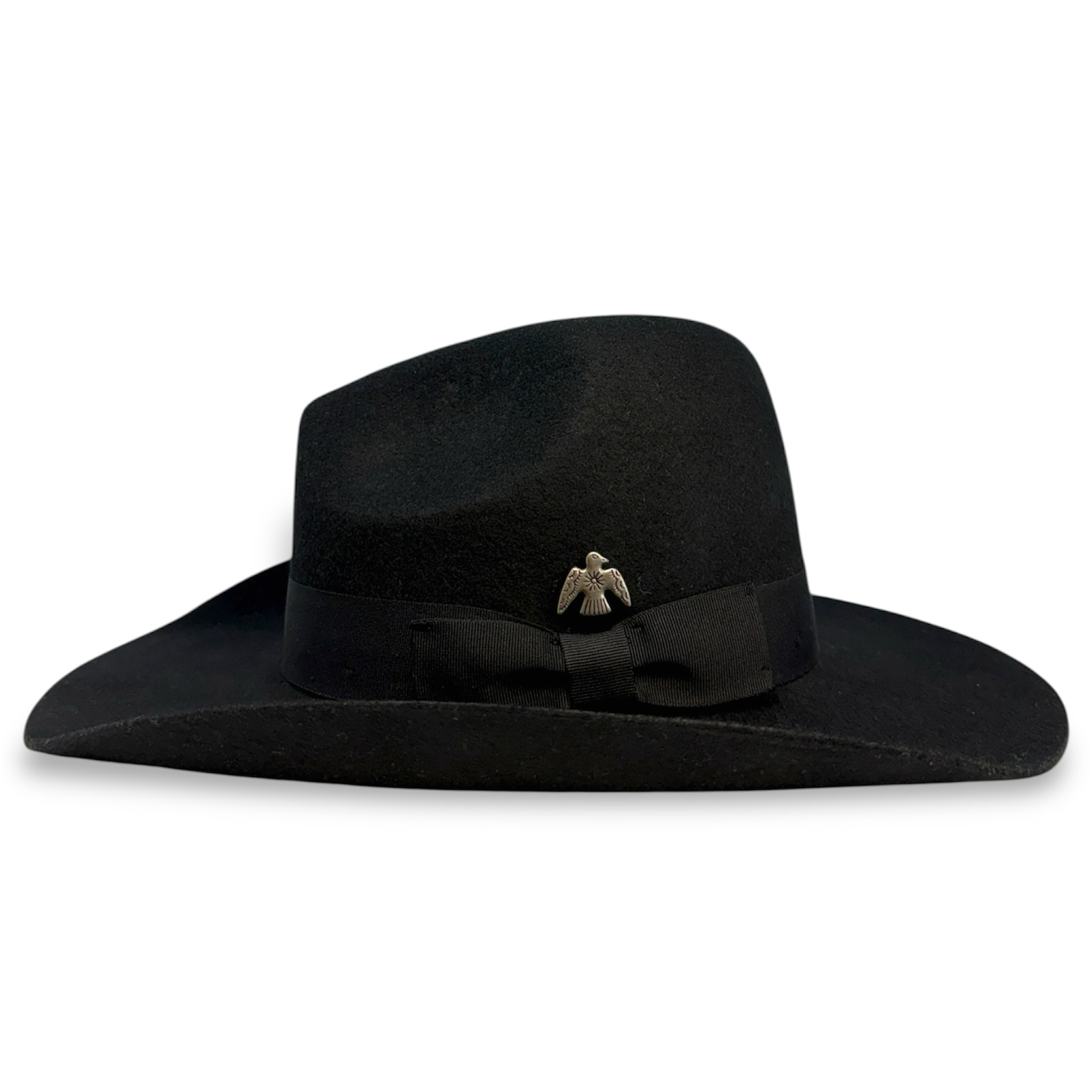 Back view of black felt cowboy hat showing the grosgrain band, black bow, and silver thunderbird concha in a native style.