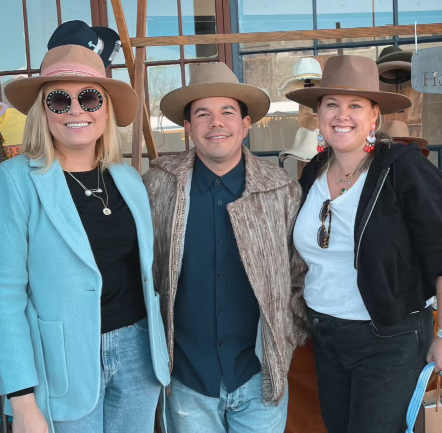 Group of guests enjoying the custom Hat Bar experience with House of Hatters