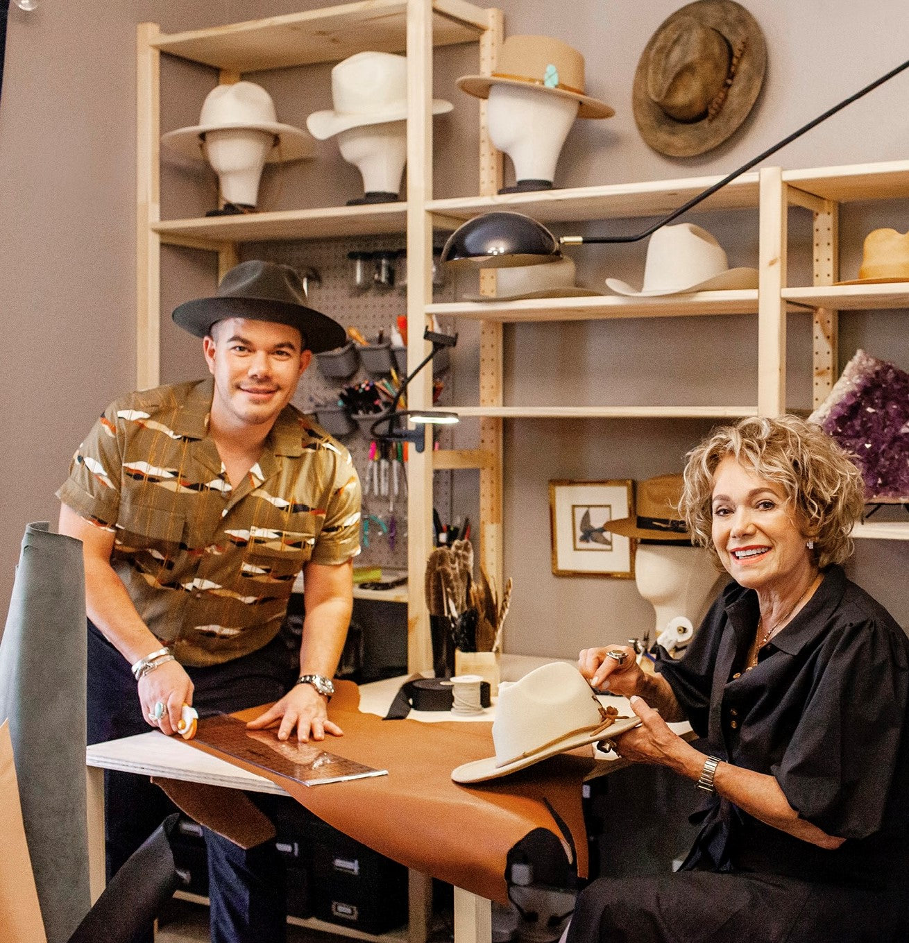 House of Hatters hatter adding personalized details to a custom hat