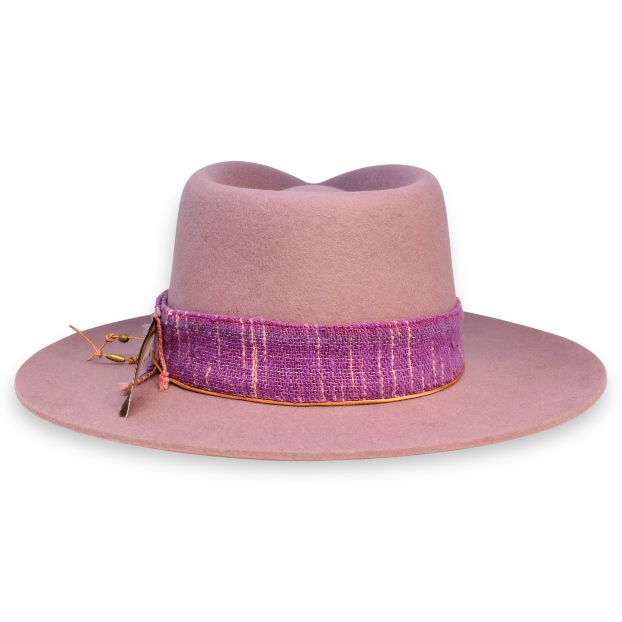 The back side of a pale purple hat showing off the magenta and pink textiles.