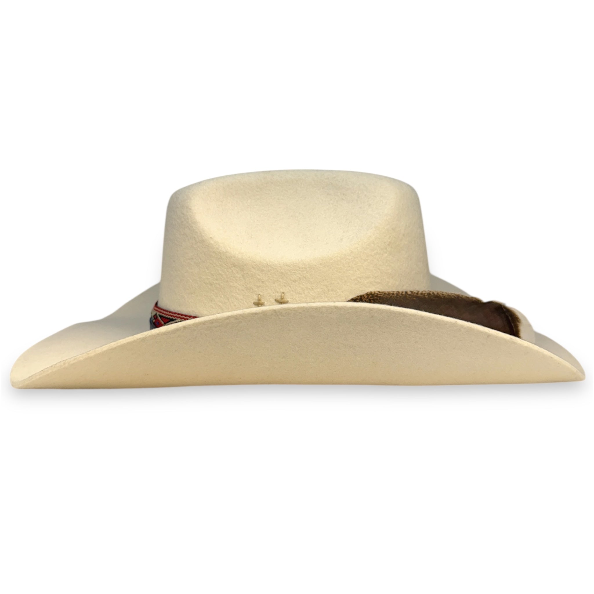 Side view of custom beige felt cowboy hat showing the wings of the hat.