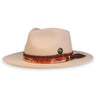 A sand colored felt fedora with two leather bands, a brass buffalo coin, and a feather crafted by House of Hatters.